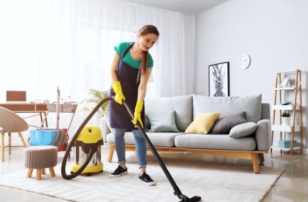 woman holding a vacuum cleaner