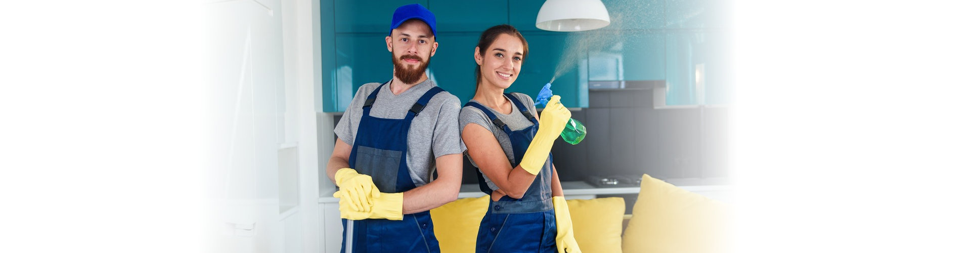 two cleaners holding their respective cleaning equipment